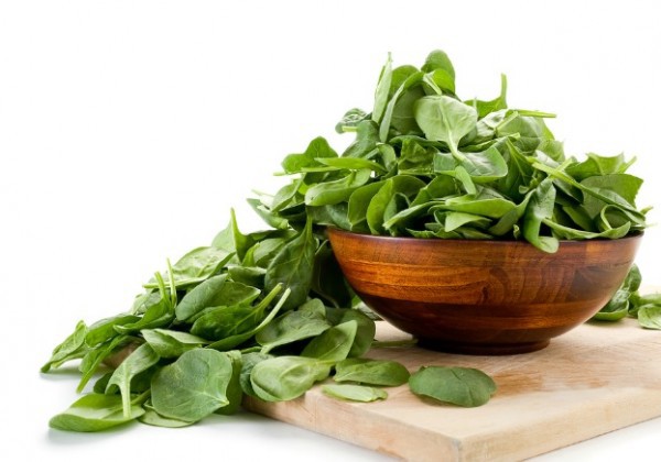 What is a healthy serving of spinach per day?