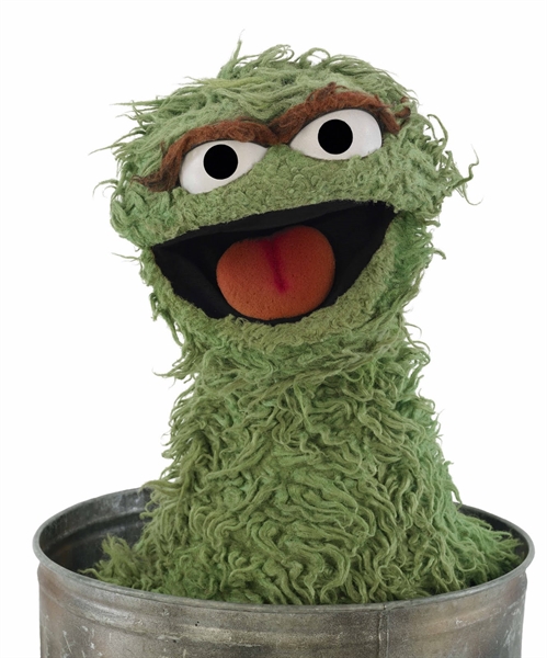 Does Oscar the Grouch live in a trash can because he is lazy and does not want to contribute to